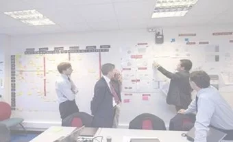 A team analyzing a board