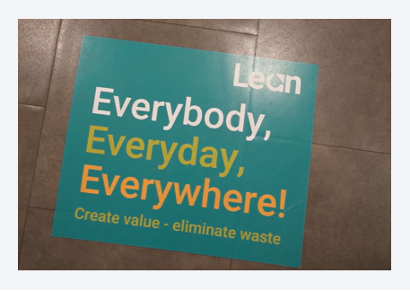 Poster presenting PHOENIX Belgium’s Lean principles: “Everyone, every day, everywhere – Create value, eliminate waste”